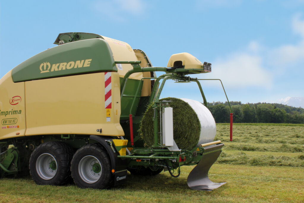 Krone baler using replacement film for secure and efficient silage wrapping