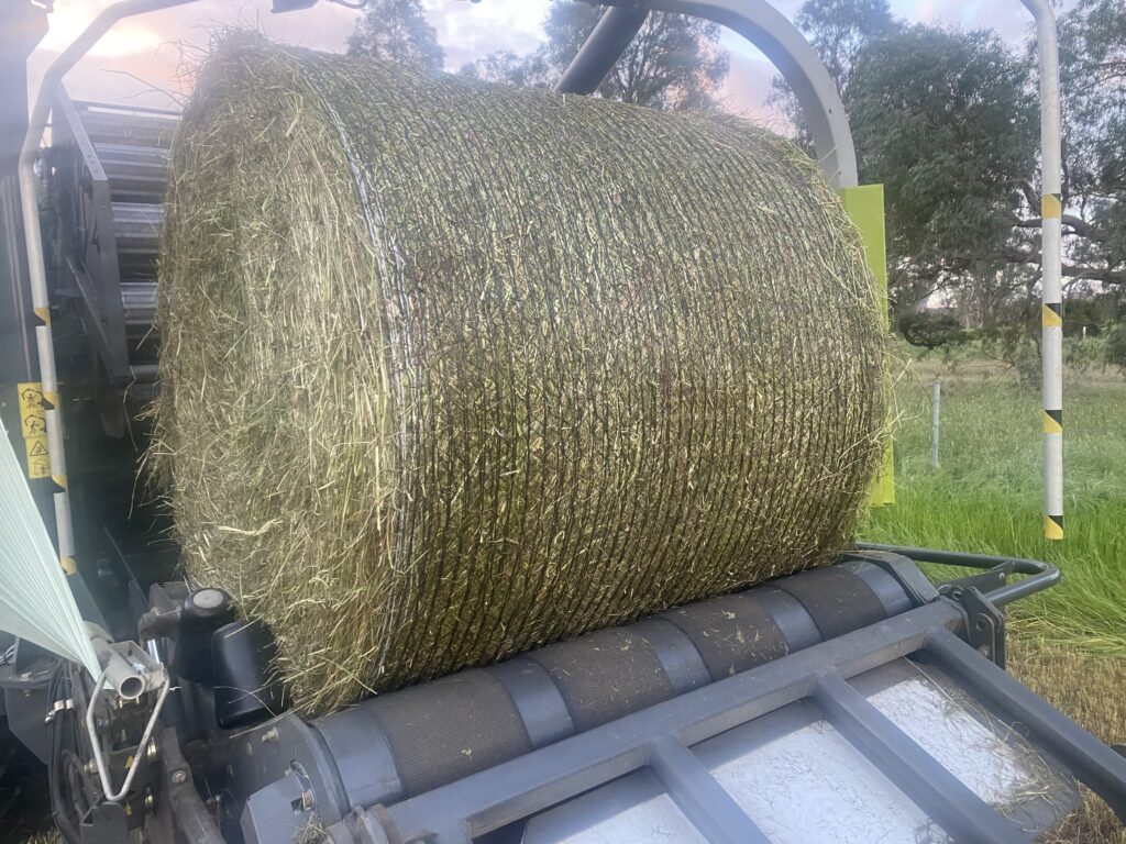 Econet bale wrap covering round silage bales