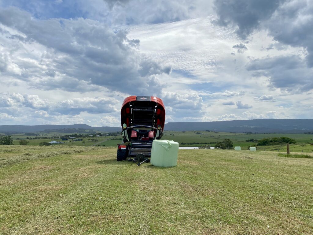 Freshly wrapped silage bale with silage plastic providing UV protection and oxygen barrier.